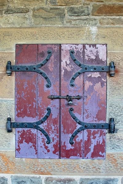 Doors with wrought iron hinges are found in an outdoor passageway at Cardiff Castle-Wales
